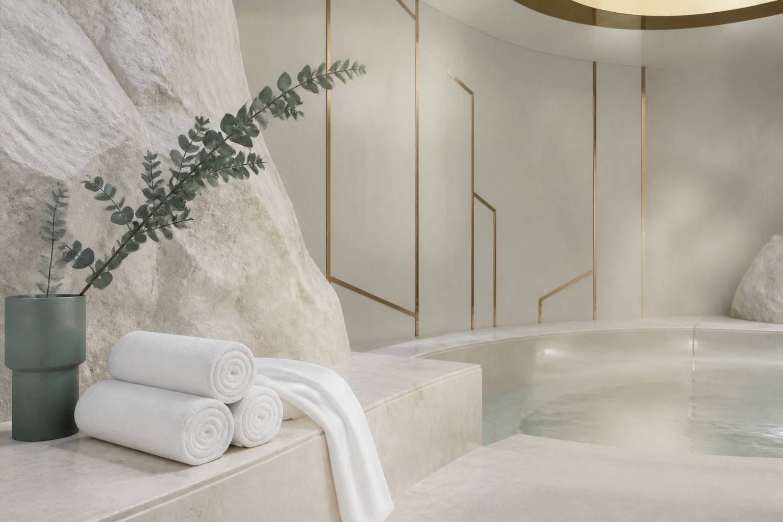 Espace spa minéral avec bassin en pierre et serviettes blanches